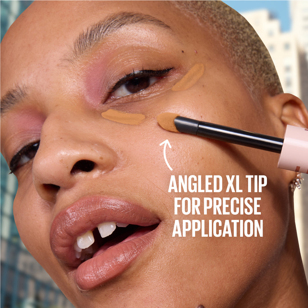 Person applying makeup with a brush, focusing on precise application.