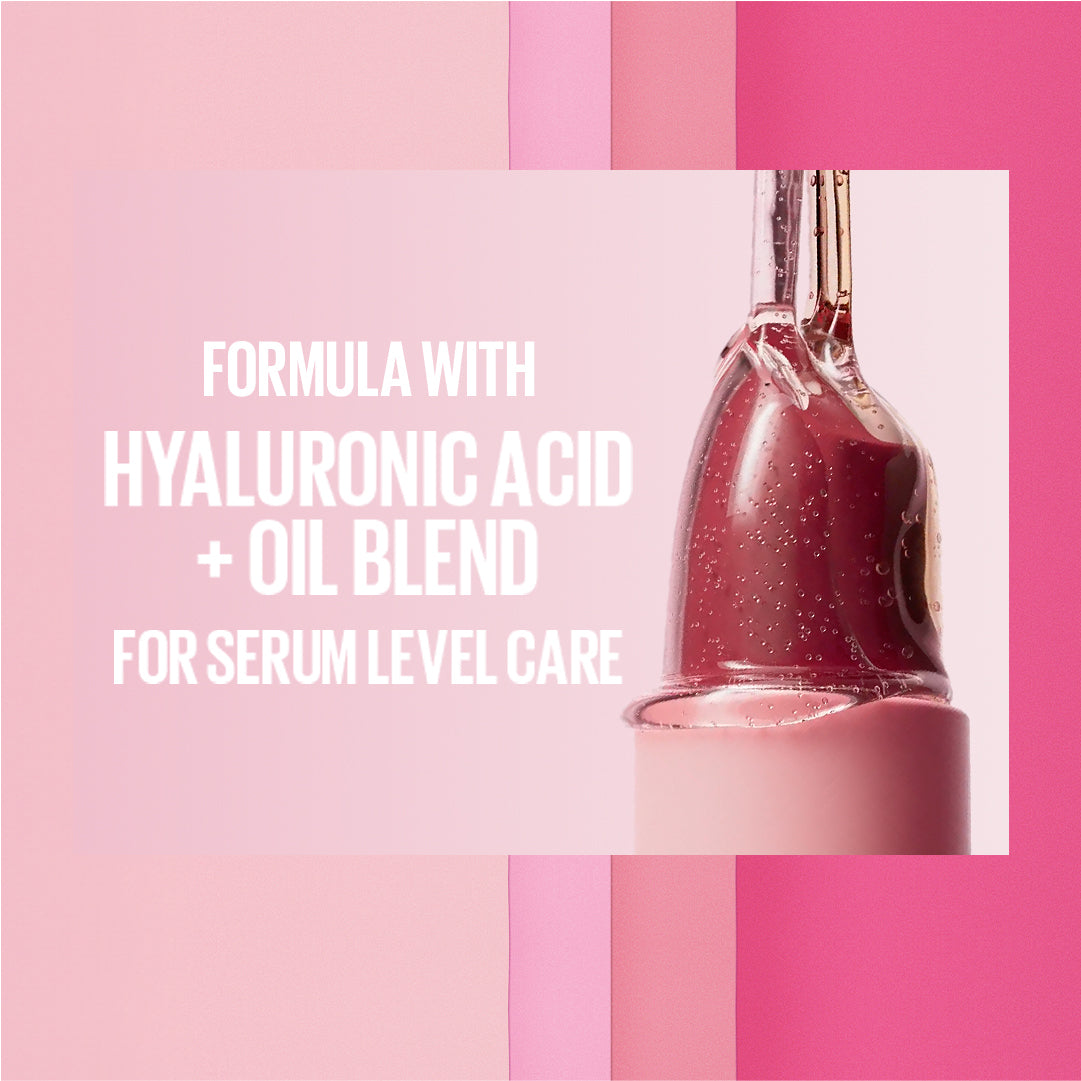 Cosmetic bottle with text about hyaluronic acid and oil blend on a pink background