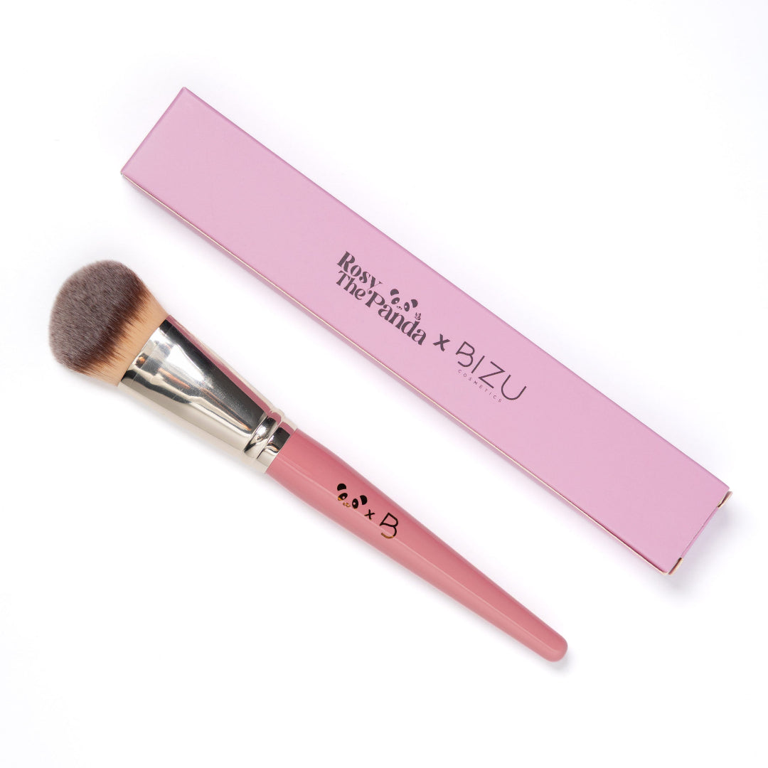 Pink makeup brush with a matching pink box featuring 'Rosy the Panda x BIZU' branding on a white background.